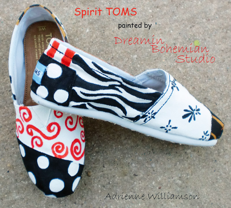 Orange, gold, black and white designs painted on cheer toms Cheer Team spirit toms with design