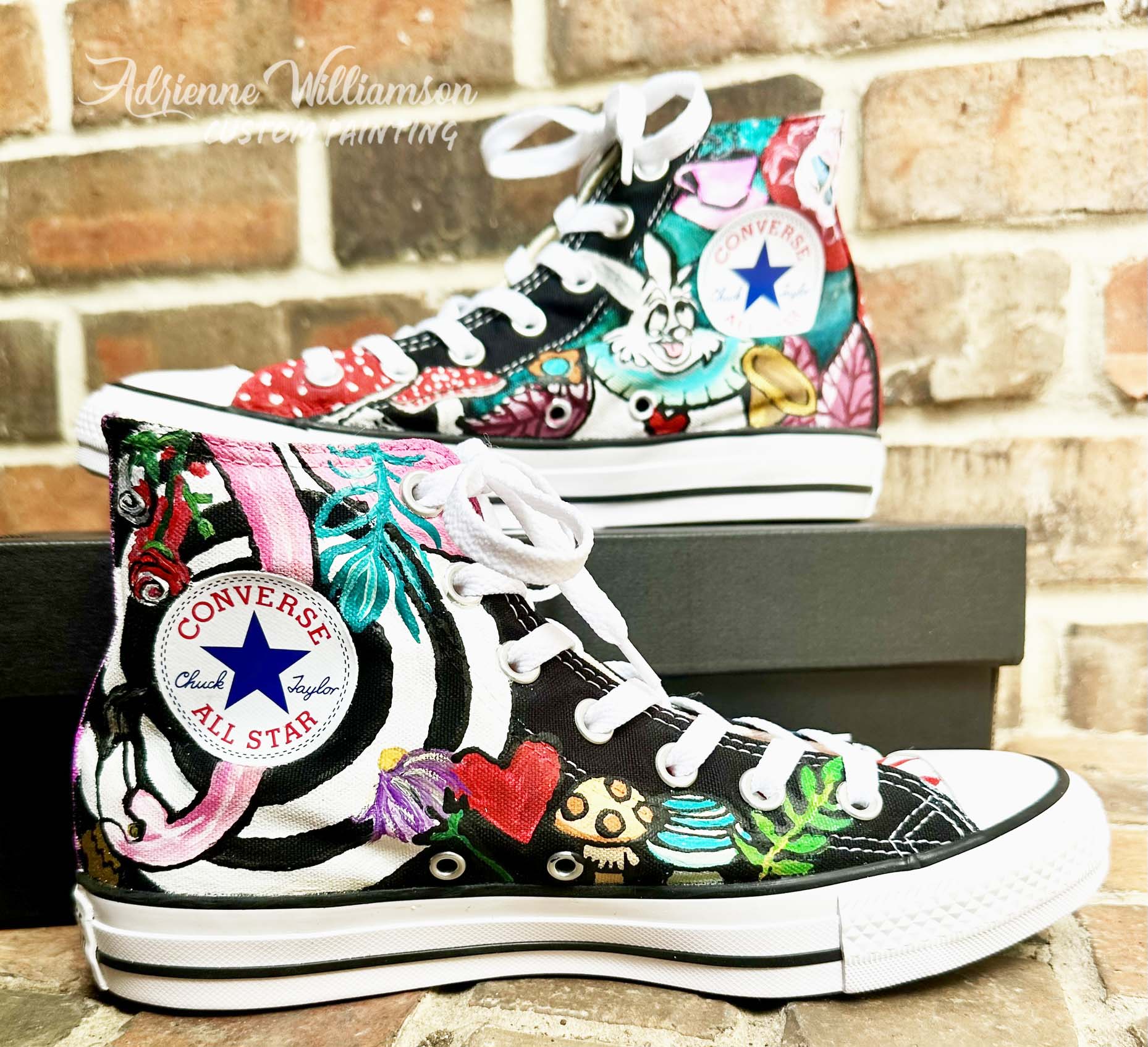 pair of Converse painted with wonderland theme on the in side of the shoes