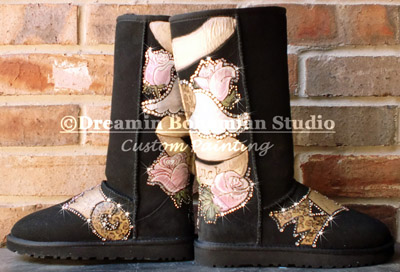 black uggs painted with vintage tattoo design in pink, cream, gold and browns