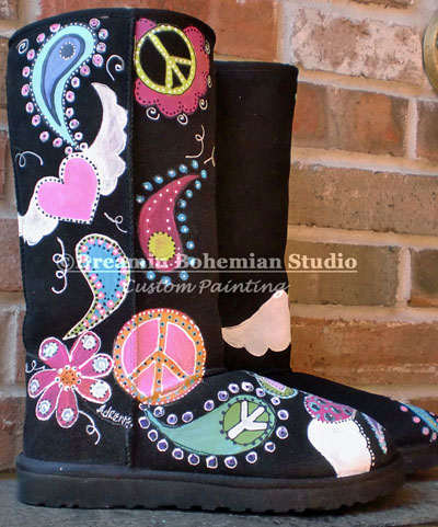 Custom painted black ugg boots with a floral, peace sign and paisley design