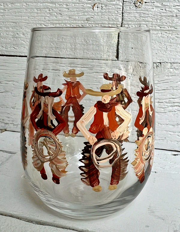 cowboys and cowgirls painted around a white wine stemless glass