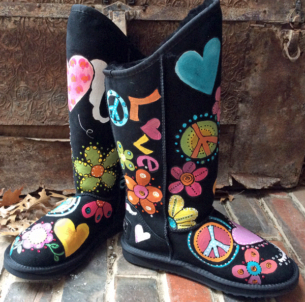 peace love and kindness painted on these ugg boots with lots of color in florals, paisley and peace signs
