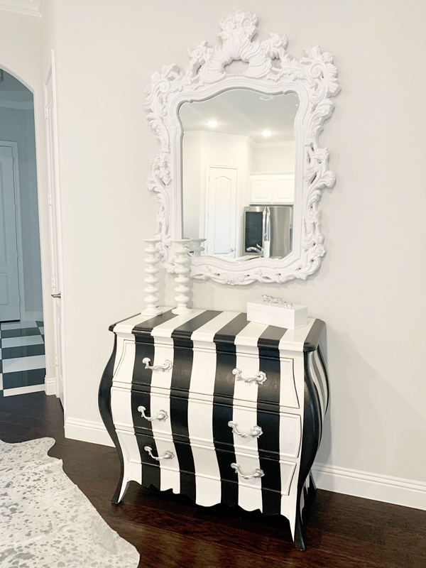 hand painted black and white stripes on an antique chest with curved lines