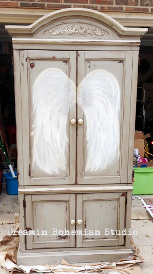 painted armoire taupe and light blue with angel wings on the front