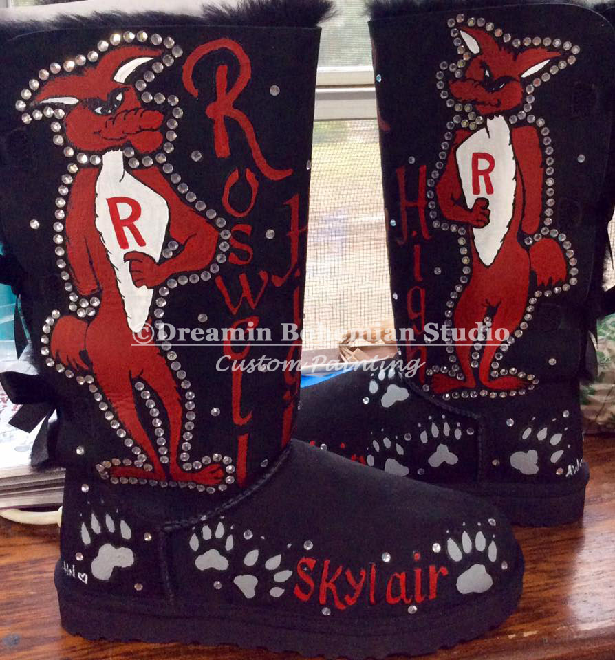 Black ugg boots with a school mascot painted on them complete with crystals