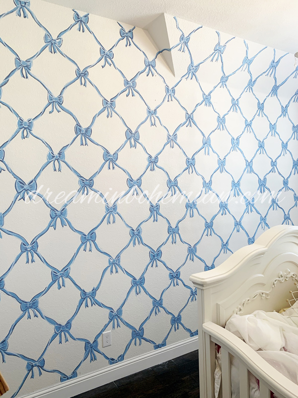 hand painted baby blue bows on a white wall