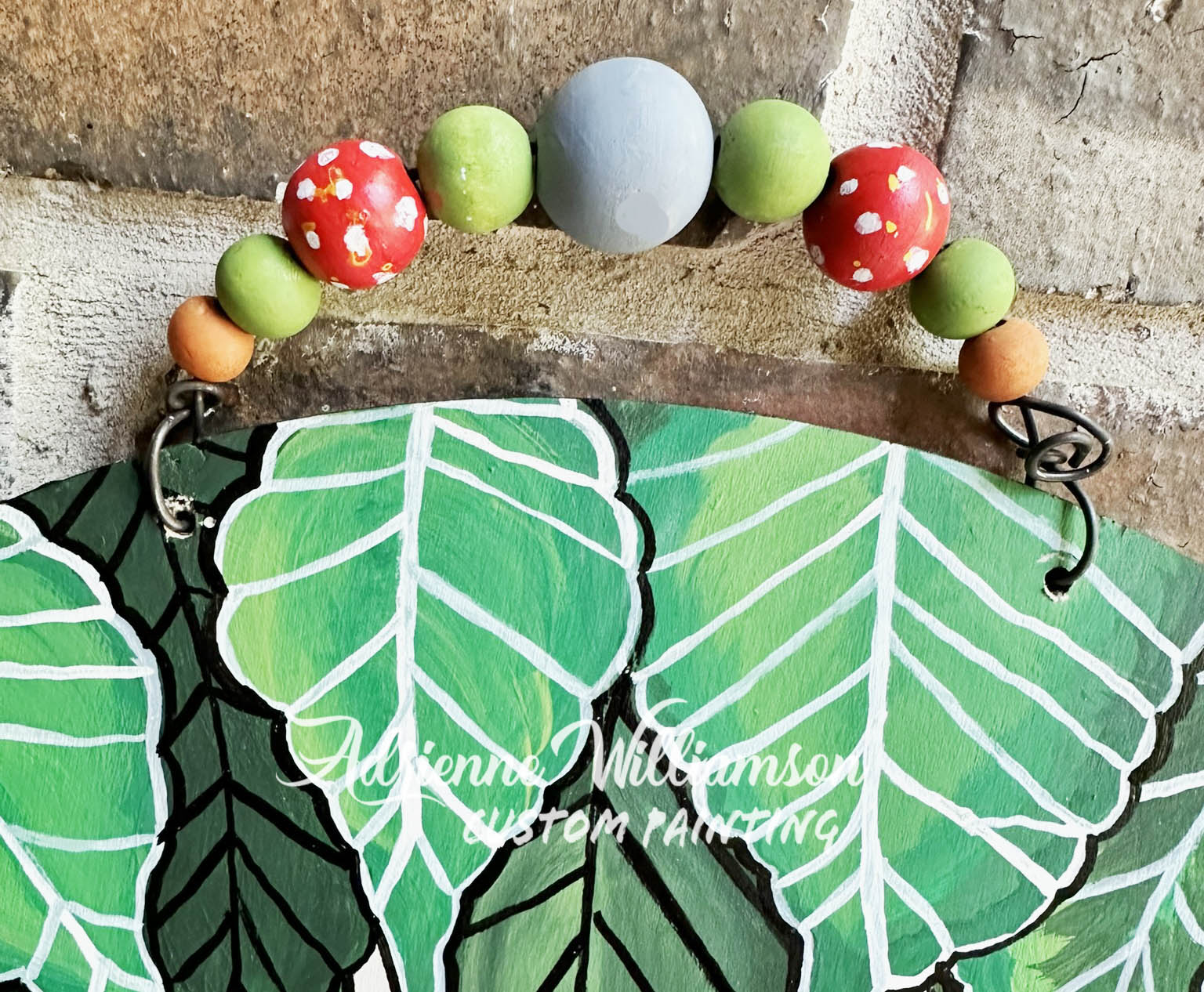 painted beads on a wire hanger