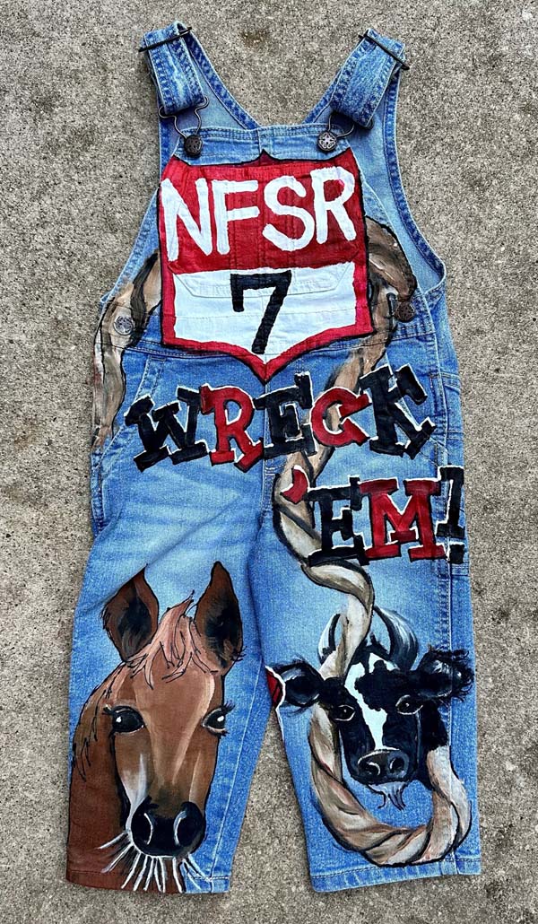 the front of rodeo themed hand painted overalls
