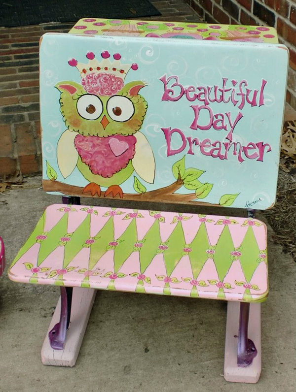 old time school desk painted with colorful owls